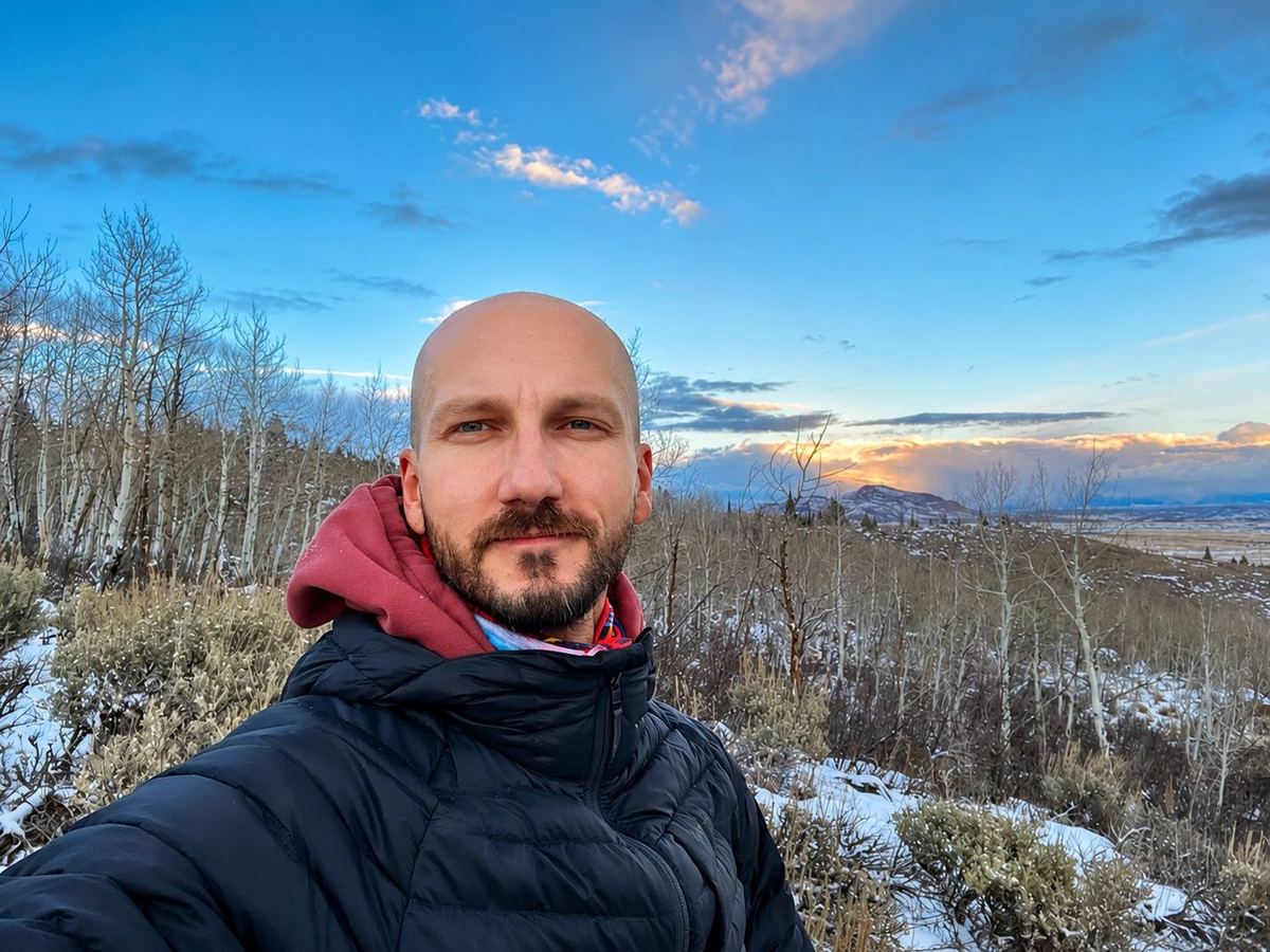 Roberto in winter mountains, contemplative